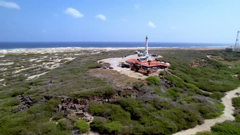 california lighthouse in aruba aerial push in