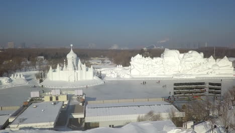 Huge-and-creative-ice-sculptures-on-park-pond-in-winter,-Harbin-China