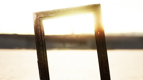 empty wooden picture frame on the beach sand