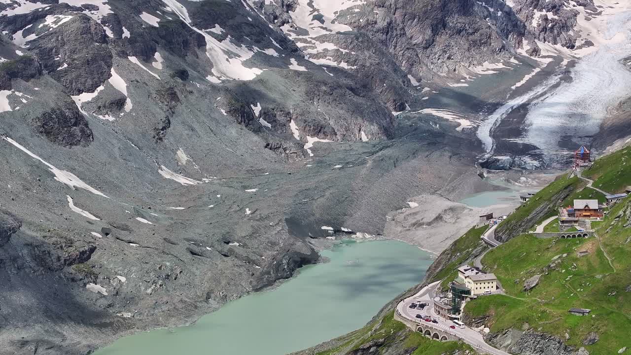 The großglockner high alpine road winding through rugged mountain terrain, aerial view