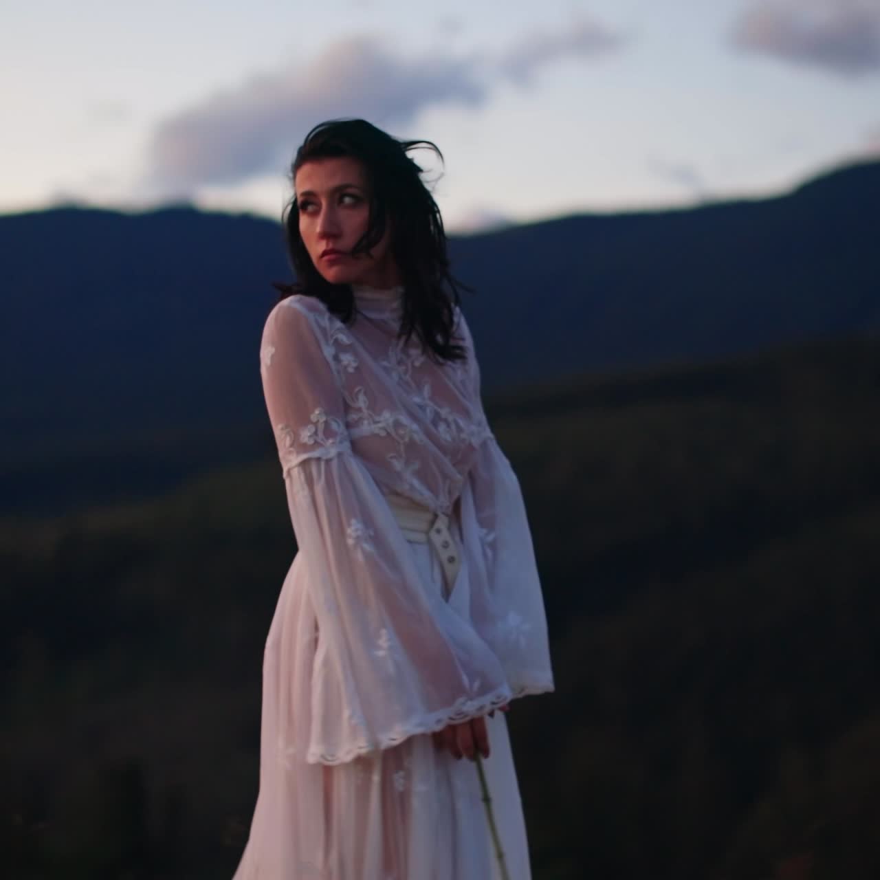 Cheerful pretty woman walking on beautiful landscapes. Beautiful lady in dress dancing on nature