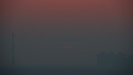 the beautiful sunset on the foggy background. time lapse