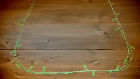 animación de luces de hadas parpadeantes con espacio de copia en fondo de madera