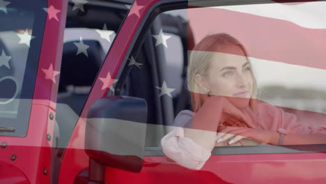 animation of flag of usa over caucasian woman by car on beach