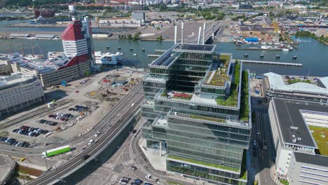 aerial around platinan and 'the lipstick" buildings and the newly built hisingsbron bridge over gota alv river in gothenburg city, sweden