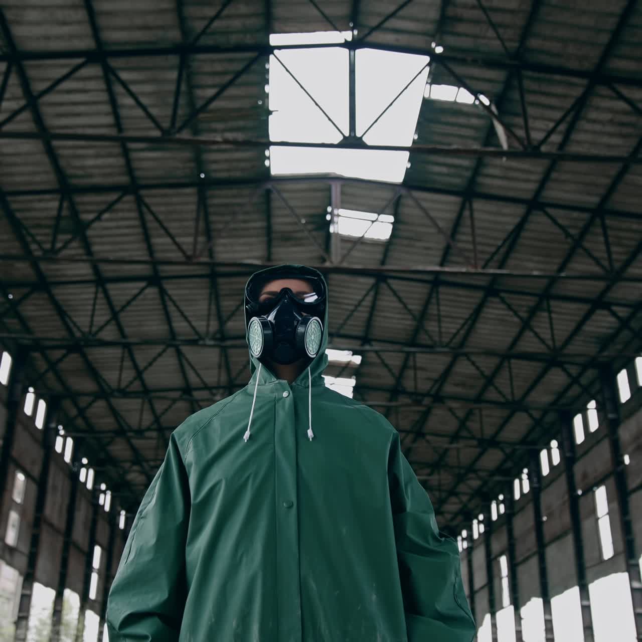 Portrait of a person in gas mask in destroyed building. Technogenic catastrophe. Post apocalyptic world. Survivor after nuclear chemical war