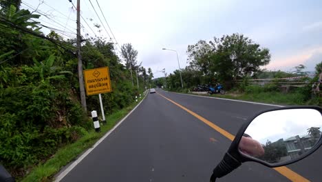 view of the road and the side mirror of motorcycle