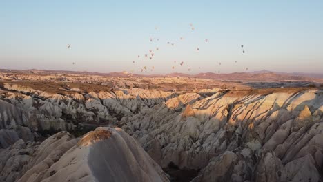 mountains and balloons at the magical sunrise in cappadocia, turkey