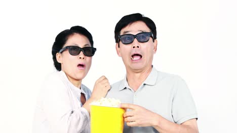 asian couple watching a 3d movie