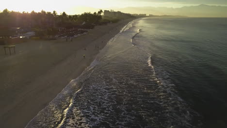 Aerial-of-sunrise-on-Bucerias,-Mexico