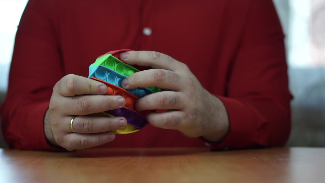 Hands manipulating toys to relax