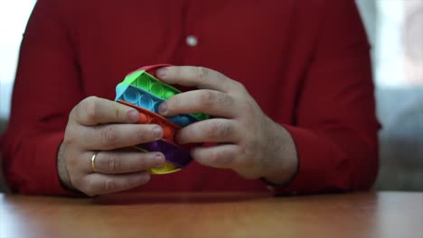 hands manipulating toys to relax