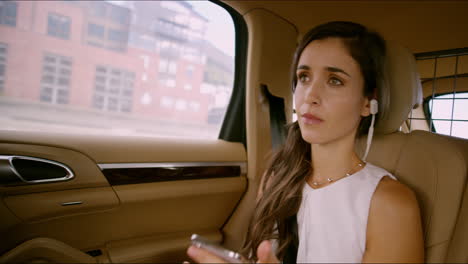 a woman listening to music while commuting