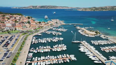 palau harbor and ferry transport to la maddalena islands, sardinia, italy - aerial 4k