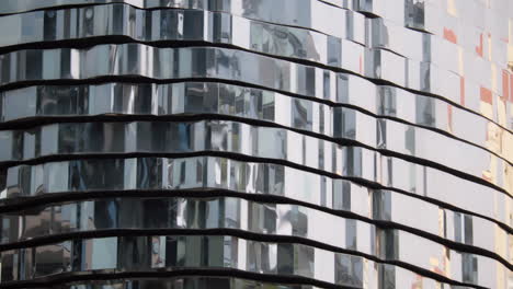 reflective metal facade of a modern building