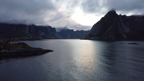 Drone-flying-over-stockfish-wooden-drying-racks-in-fishing-village-Hamnoy-in-northern-Norway-in-the-Lofoten-islands