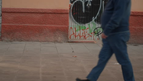 man walking on city street