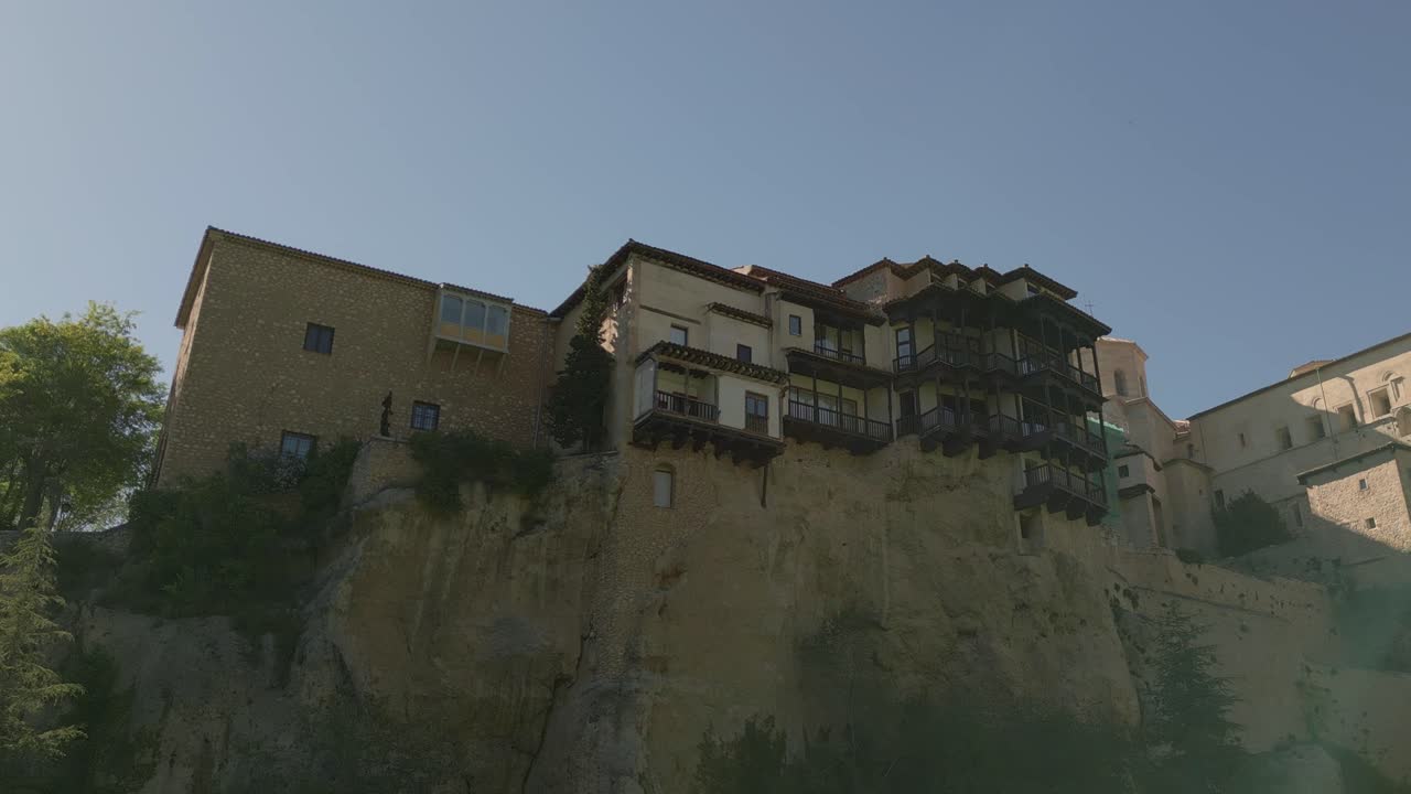 Hanging houses of Cuenca. Aerial view of medieval houses next to a cliff. Orbital view. Casas colgadas. Cuenca. Spain.