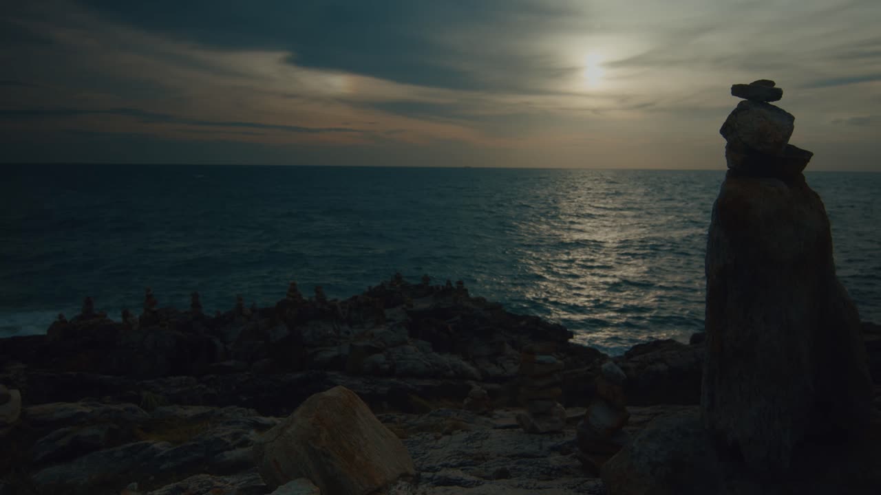 Sunset over the Ocean with Stone Caims