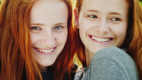 close-up portrait of two happy sisters twins 3