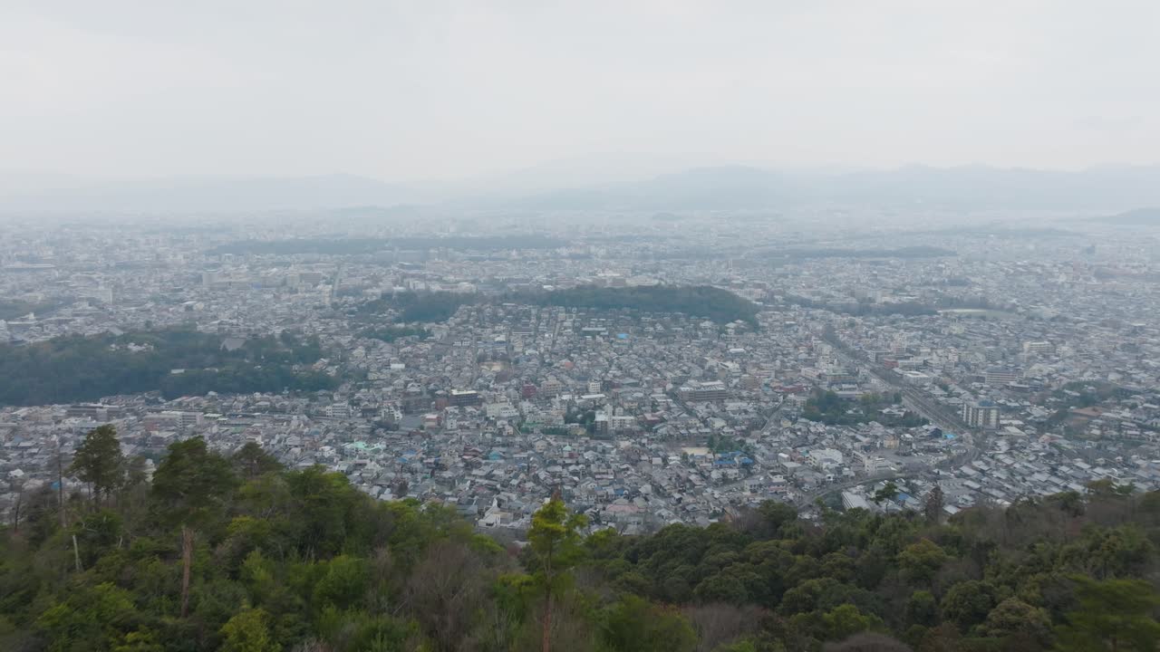 Aerial Drone fly Kyoto Japan Cityscape Seen from Daimonji Yama in Daylight