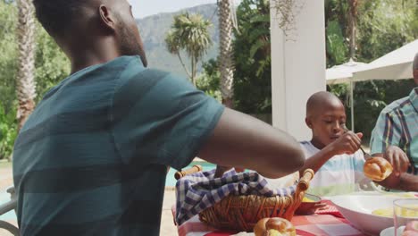 Happy-family-eating-together-at-table