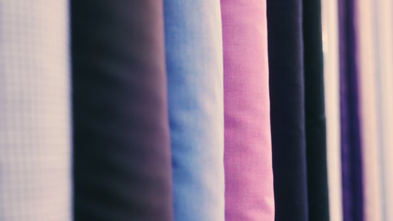 4K Cinematic fashion clothing footage of different colored clothing materials and fabric in a tailor's shop
