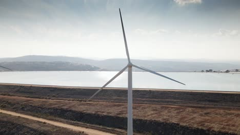 Aerial-view-of-wind-mills-farm-in-Ma'ale-Gilboa-in-the-Lower-Galilee,-northern-Israel-on-a-bright-sunny-day