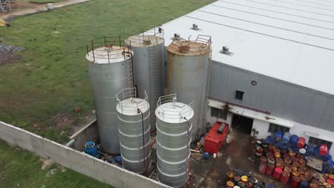 aerial view of industrial area with large storage tanks