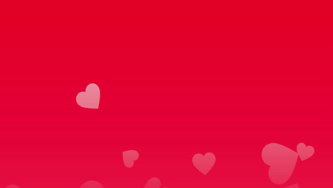 Pink-hearts-floating-upwards-on-a-red-background