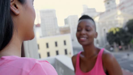 women hugging each other in balcony at home 4k