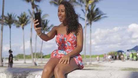 bright cheerful woman chatting via phone