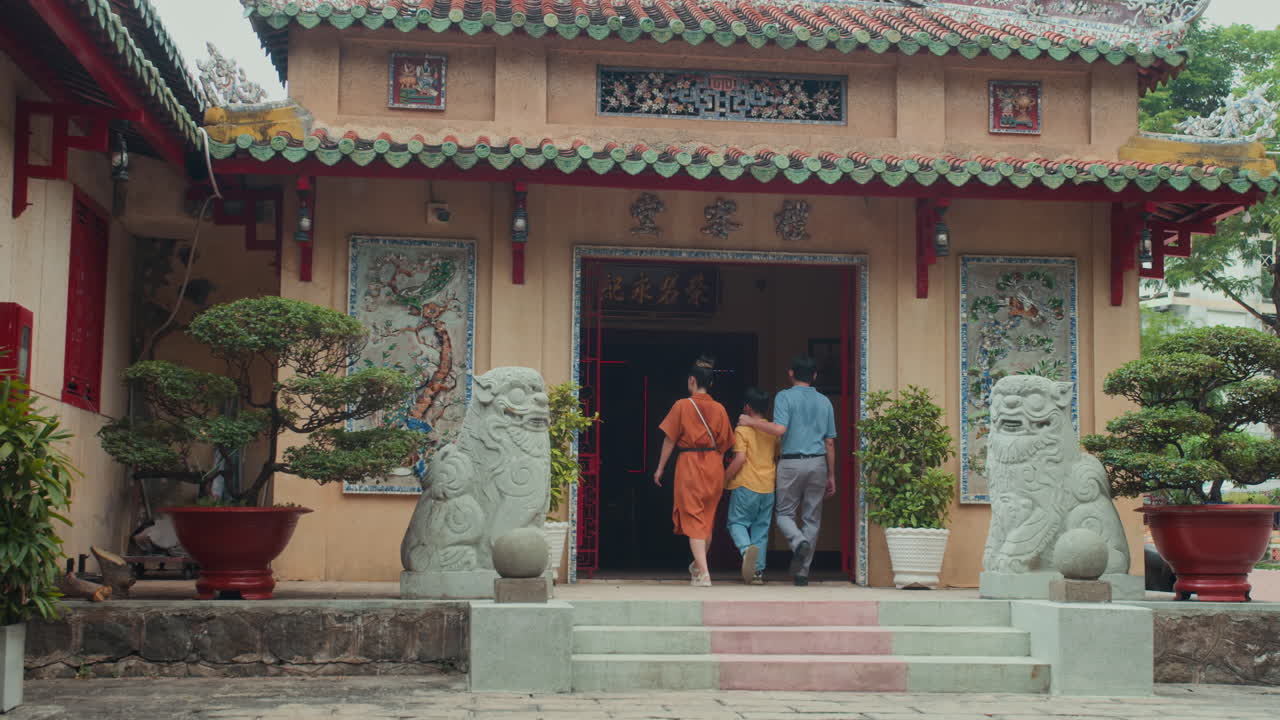 Parents and Son Going to Holy Asian Place for Prayer