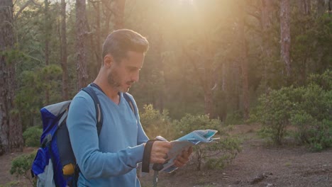 male traveler reading map