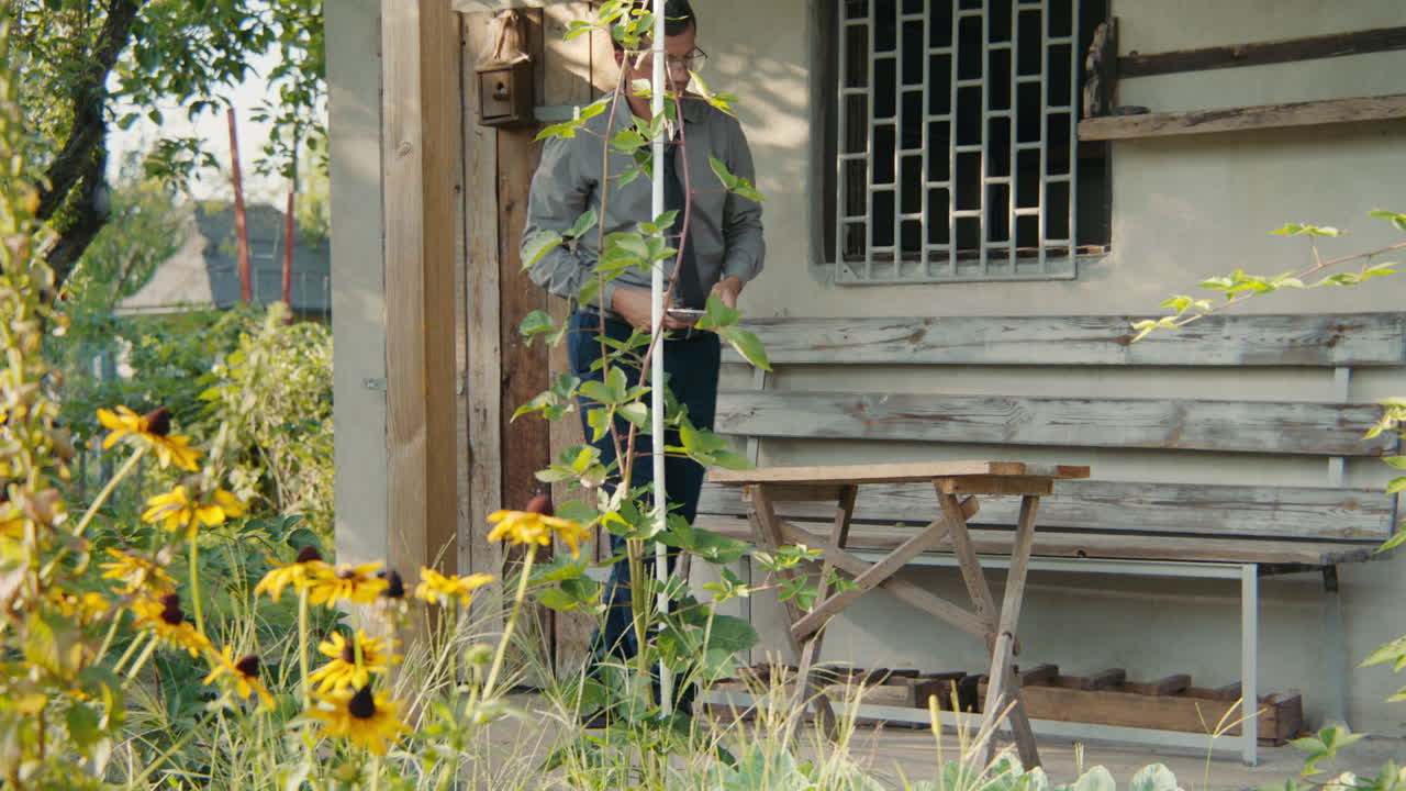 Man working on wooden furniture outdoors