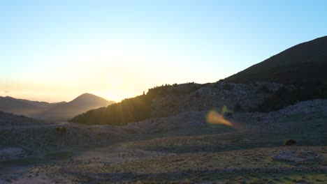 sunset over mountain valley