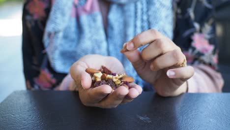 Woman holding mixed nuts