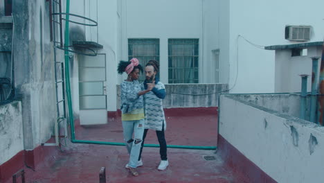 couple dancing tango on a rooftop in poor neighborhood