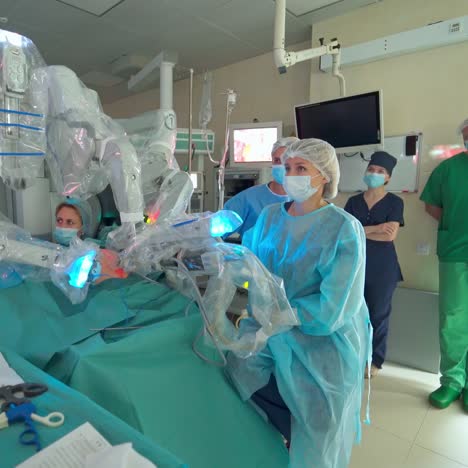 surgery robot in operation room. doctor and assistants using medical equipment in the operating room