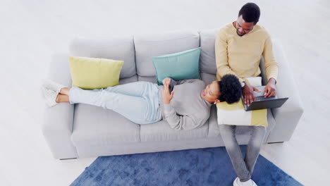 couple, top view and living room with laptop