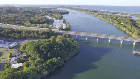 Flying-Over-Barneys-Point-Bridge-and-Palm-Lake-Resort,-New-South-Wales,-Australia