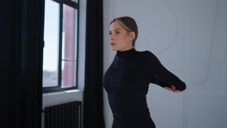 woman stretching in studio