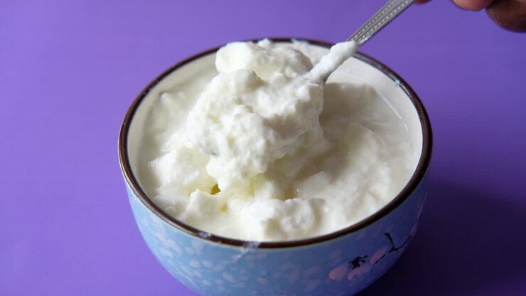 Homemade Yogurt in a Bowl with a Spoon