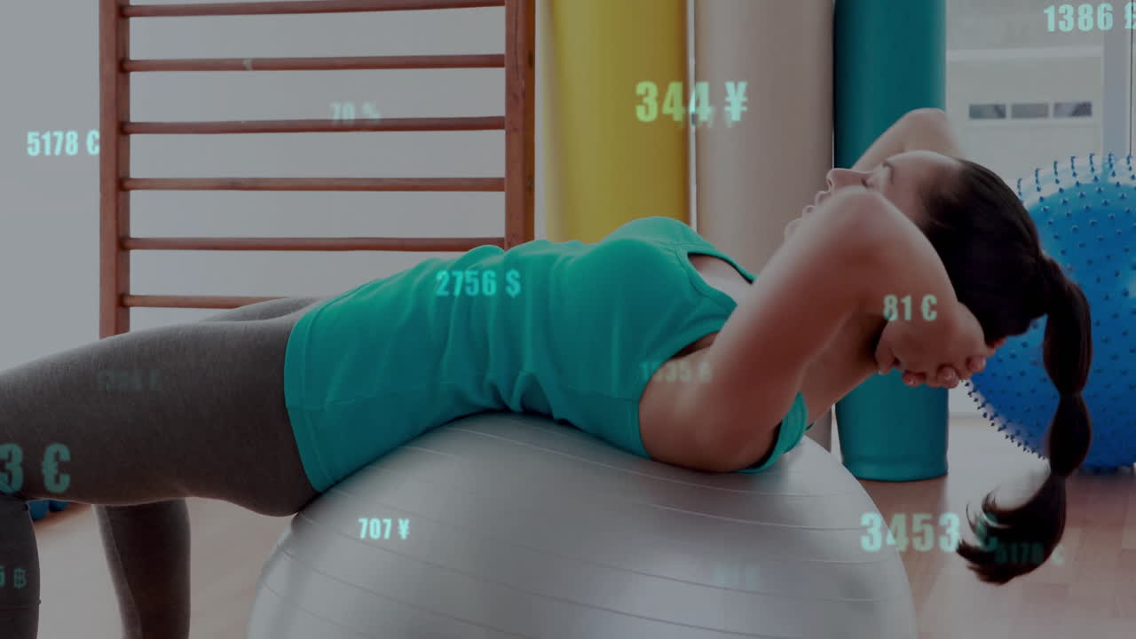 Person exercising on stability ball with financial data animation overlay