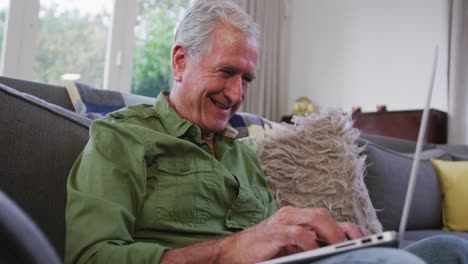 Senior-Caucasian-man-smiling-and-spending-time-at-home-