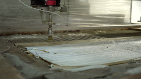 cleaning the foam on the cnc water jet cutter with water pistol