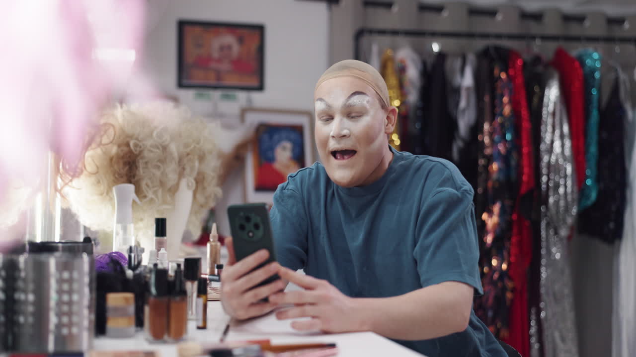Drag queen in dressing room video chatting