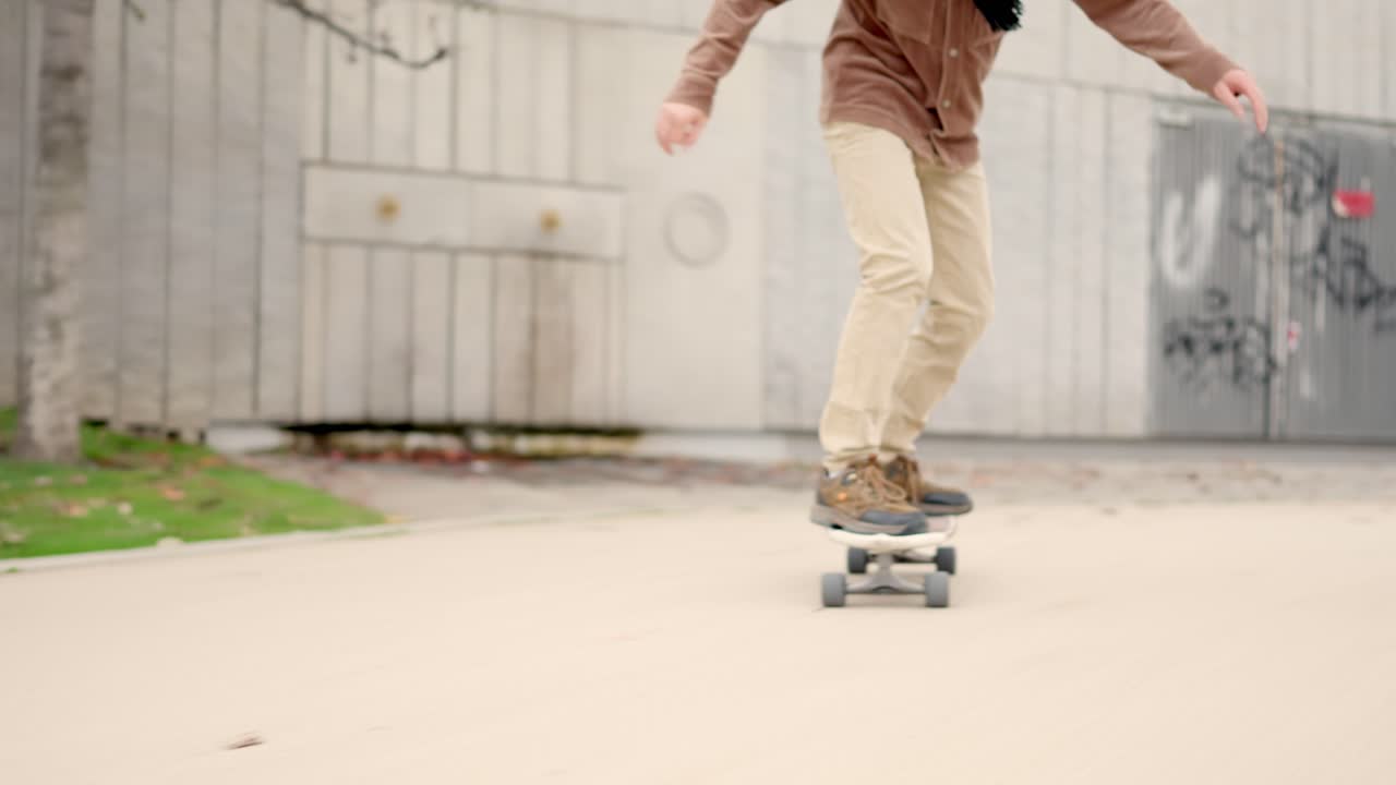Lower part of a man in skateboard in a park