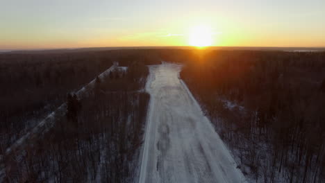 A-snowy-road-in-a-forest