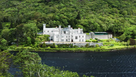 kylemore abbey and grounds seen across pollacpal lough